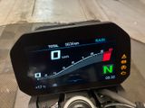 a motorcycle that has a display on it ' s dashboard
