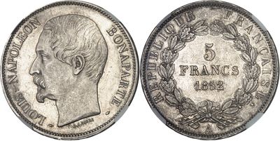 a close up of a coin with a man ' s face on it
