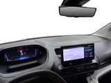 the interior of a car with a steering wheel, dashboard, and display screen