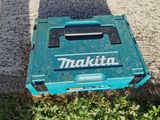 a blue tool box that is sitting on the ground
