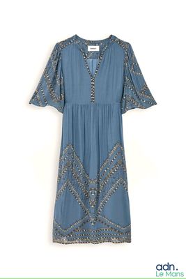 the dress is blue and has a pattern on it