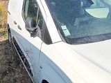 a white van that is parked on the side of the road