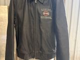 leather motorcycle jacket on a mannequin stand in a garage