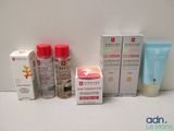 several different types of skin care products sitting on a table
