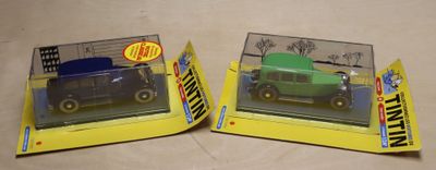 two boxes of toy cars that are on a table