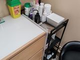 a desk with a sink and a chair in a room