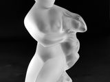 black and white photograph of a figurine of a boy holding a baby