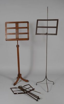 two music stands that are standing next to each other