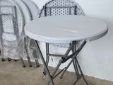 two chairs and a table in the corner of a room