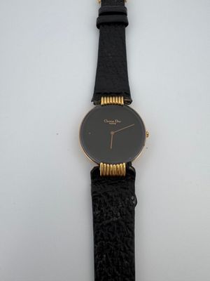 Christian DIOR Montre bracelet de dame en métal plaqué or, b…