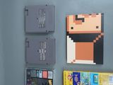 three nintendo game cartridges on the wall next to each other