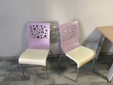 three chairs sitting next to each other near a table