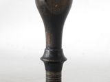 a small black object on a white surface