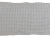 a white crocheted blanket on a white background