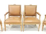 three chairs with leather upholstered back and arms are shown