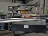 a machine that is cutting a piece of metal