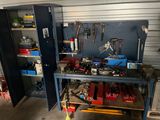 a workbench with tools on it in a garage