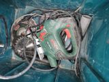 an image of a green tool in a blue container