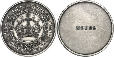 a close up of a coin with a crown on it