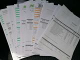 a lot of papers that are sitting on a table