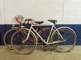 two bikes parked next to each other in a room