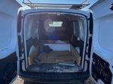 a white van that is parked on the side of the road