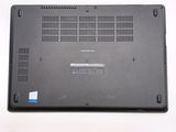 a close up of a laptop on a white surface