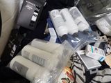a pile of toiletries and other items on a couch