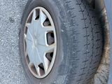 a tire that is sitting on the side of the road