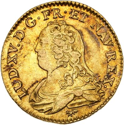 une pièce d'or à l'effigie d'une femme