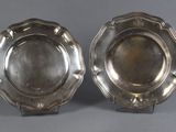 a pair of silver plated dishes on stands