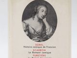 an old book with a picture of a woman in a dress
