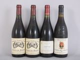 four bottles of wine are lined up on a table