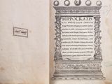 an old book with a picture of a statue on it