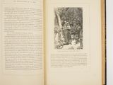 an open book with a picture of a man and a woman standing in a forest