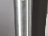 two silver vases sitting next to each other on a table