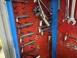a blue tool box filled with wrenches and other tools