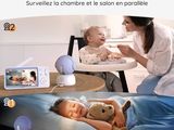 a woman that is feeding a baby in a highchair