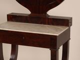 a small table with a mirror on top of it
