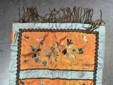 a piece of cloth with a design of flowers on it