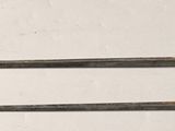 two metal handles that are attached to a wall