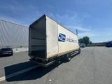 a delivery truck that is parked in a parking lot