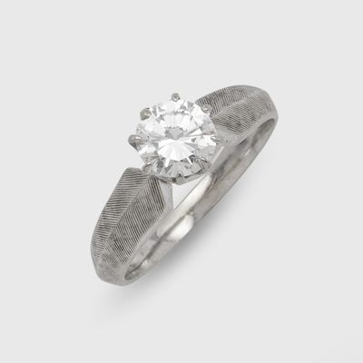 a close up of a diamond ring on a white background
