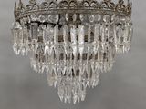 a close up of a crystal chandelier hanging from a ceiling
