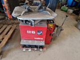 a machine that is sitting on a pallet in a garage