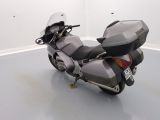 a motorcycle that is parked on the floor in a room