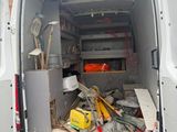 the back of a van with a bunch of tools in the back