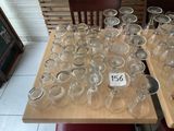 a lot of empty wine glasses on the table