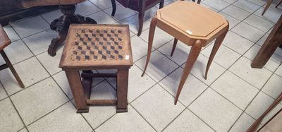 two tables and two stools in a room