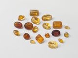 some yellow and brown gems on a white surface
